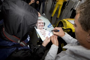 David Coulthard signs pictures for fans in Germany
