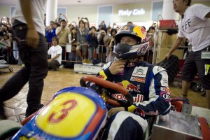 Red Bull and Citroën driver Kimi Räikkönen racing electric carts in a shopping centre in Japan.
