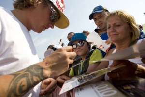 Kimi Raikkonen signs autographs