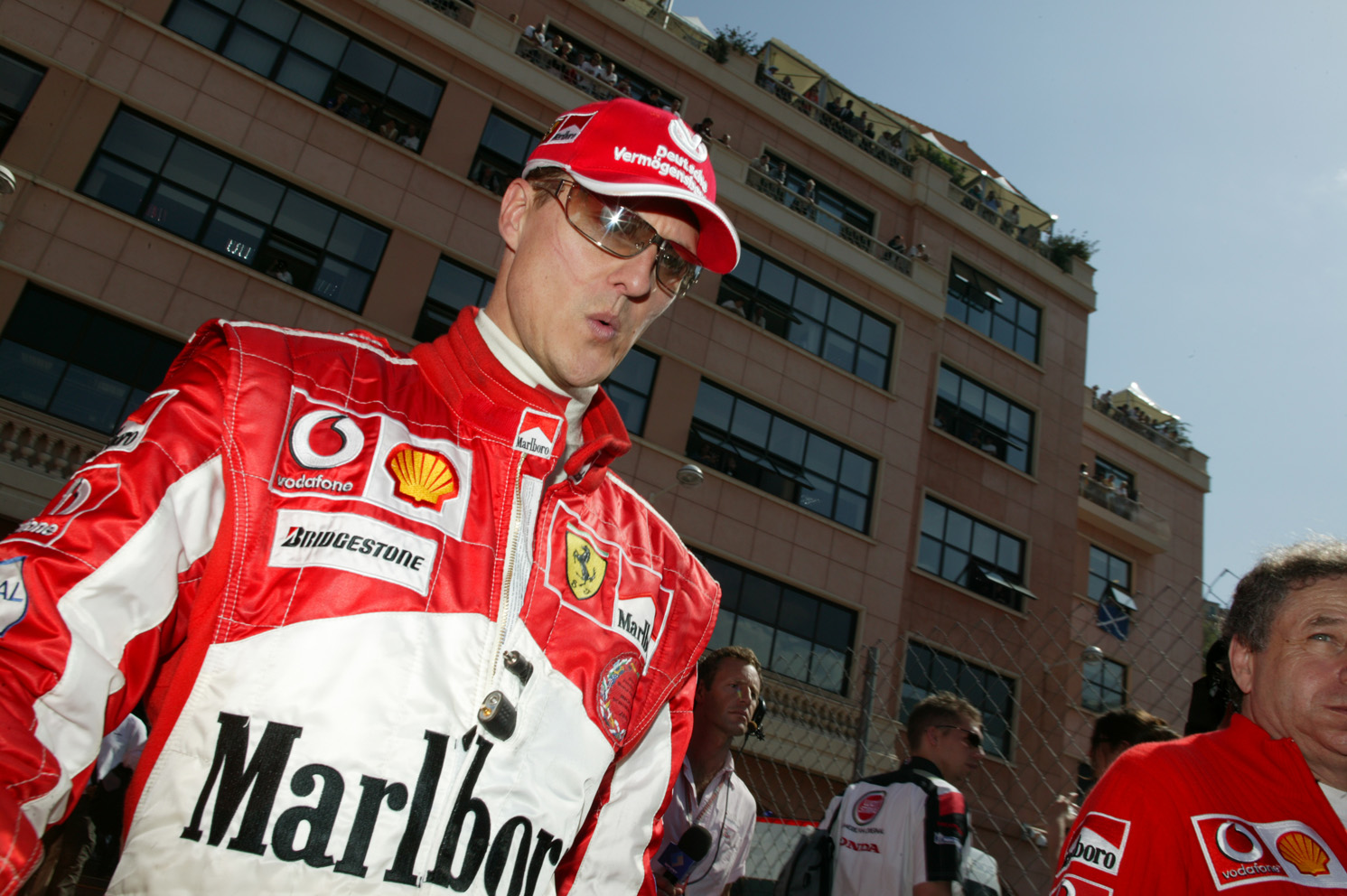 Wistle while you win, Michael Schumacher walking through the Monaco Paddock, 2005