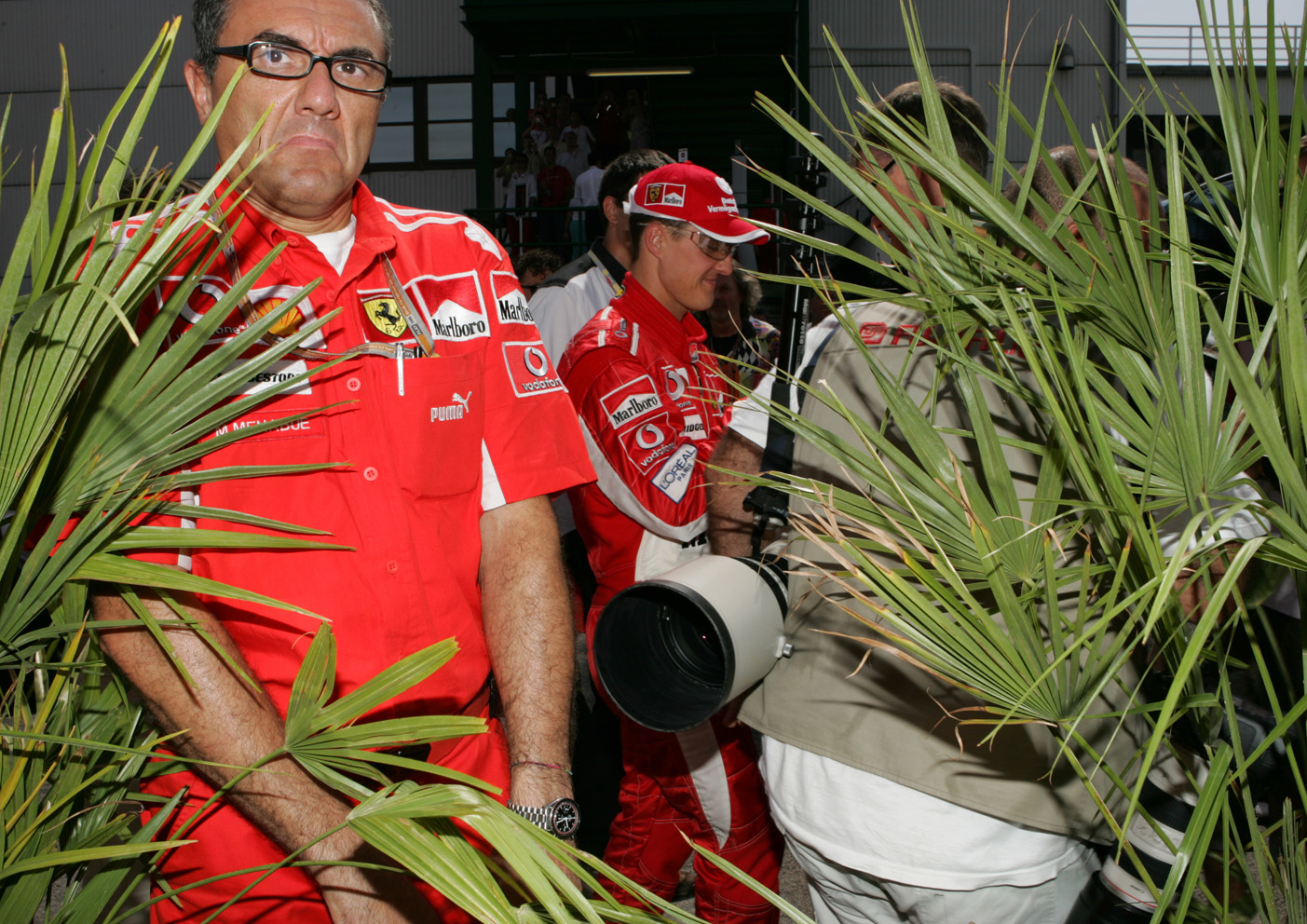 Michael Schumacher and team, squeeze through the paddock at the Canadian Grand Prix