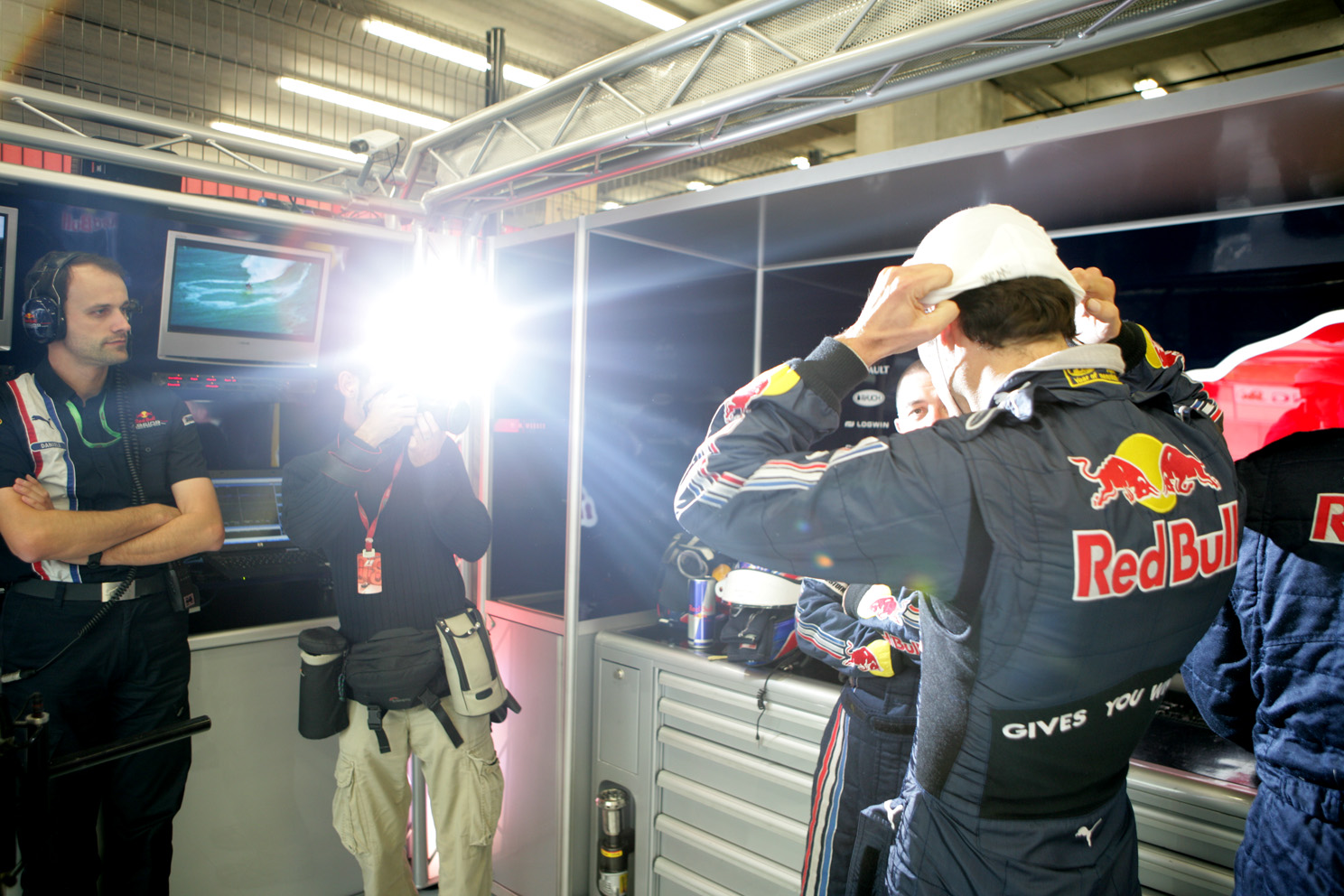 Mark Webber gets shot in the Red Bull garage before the Belgian Grand Prix