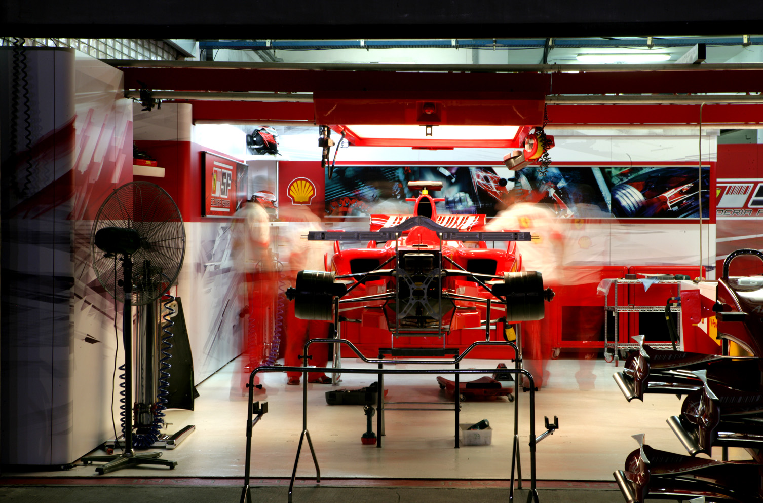 The Ferrari team works into the night, at the Japanese Grand Prix