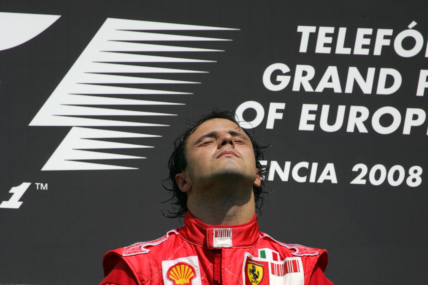 Felipe Massa soaks up the glory, and sun. At the 2008 European Grand Prix.