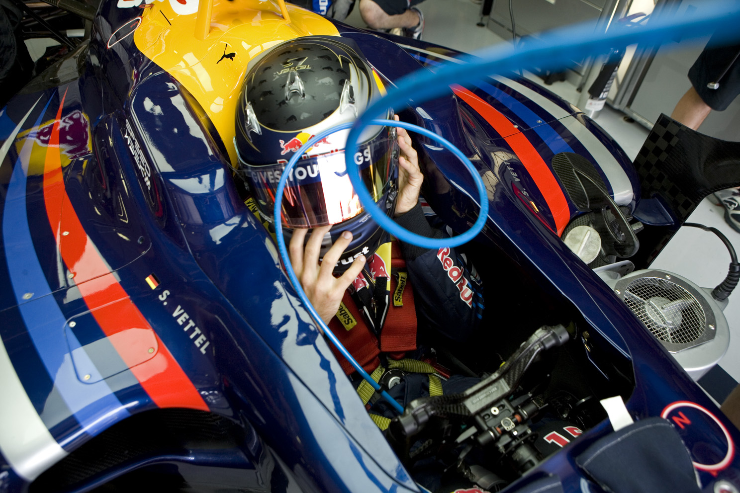 Sebastian Vettel sits in his car