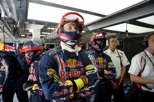 The Red Bull Racing pit crew, watches the TV Screens