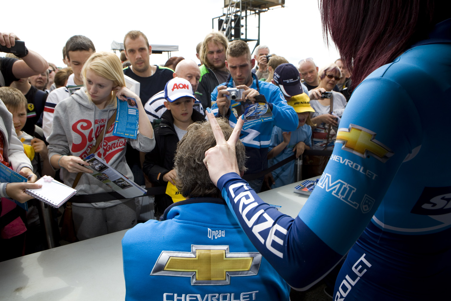 Signs autographs for fans at the Croft Circuit.