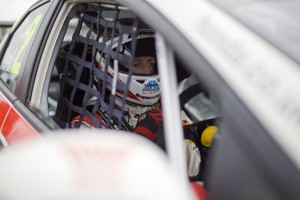 Matt Neal sits in his Honda racing car.