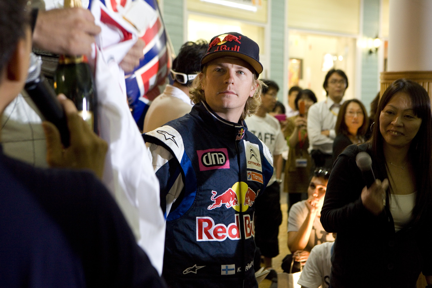 Red Bull and Citroën driver Kimi Räikkönen racing electric carts in a shopping centre in Japan.