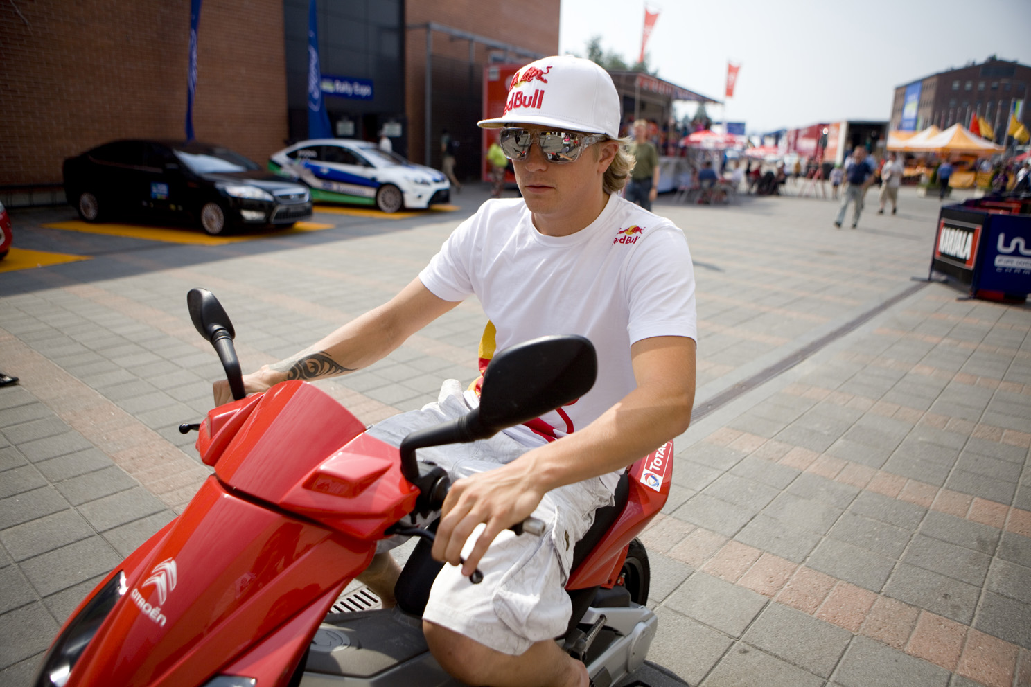 Kimi Raikkonen, on a bike (red)