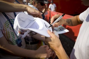 Kimi Raikkonen signs autographs