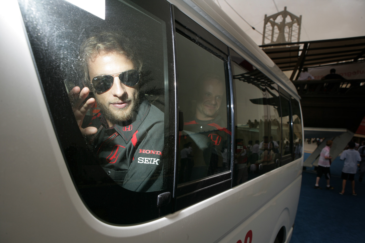 Honda's Jenson Button, waves to fans at the Bahrain grand Prix