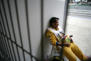 A marshal takes a break, at the Malaysian Grand Prix