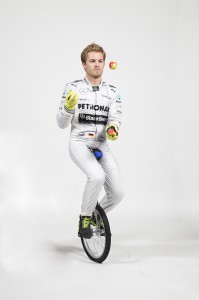 Nico Rosberg, Mercedes F1 Driver, juggles while riding a unicycle, not easy.